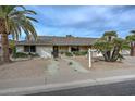 Front view of a single-story house with a walkway and landscaping at 13322 W Ballad Dr, Sun City West, AZ 85375