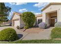 House exterior featuring a two-car garage and landscaped front yard at 25350 W Riverside St, Buckeye, AZ 85326