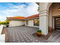 Covered patio with tile flooring and a relaxing seating area at 8643 E San Jacinto Dr, Scottsdale, AZ 85258