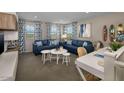 Spacious loft area with comfortable seating and a built-in workspace at 36433 W San Ildefanso Ave, Maricopa, AZ 85138