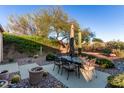 Relaxing patio area with seating and a desert landscape at 41245 N Rolling Green Way, Anthem, AZ 85086