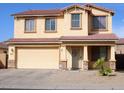 Two-story house with attached garage and desert landscaping at 43542 W Caven Dr, Maricopa, AZ 85138