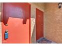 Condo entry with two red doors and keyless entry at 5525 E Thomas Rd # F9, Phoenix, AZ 85018