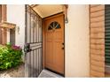 Condo entrance with security gate and landscaping at 4848 N Woodmere Fairway -- # 15, Scottsdale, AZ 85251