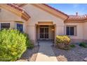 Home exterior showcasing front entryway and landscaping at 15131 W Black Gold Ln, Sun City West, AZ 85375