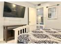 Bedroom with a queen bed, TV, and stylish decor at 7625 E Camelback Rd # B108, Scottsdale, AZ 85251