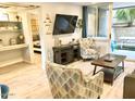 Open living room with access to bedroom and patio at 7625 E Camelback Rd # B108, Scottsdale, AZ 85251