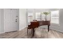 Living room with piano and hardwood floors at 6948 W Williams Dr, Glendale, AZ 85310