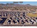 Aerial view of a residential neighborhood with nearby parks, schools, and shopping at 23376 W Miami St, Buckeye, AZ 85326