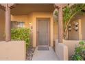 Private entrance with security screen door and landscaping at 1446 E Grovers Ave # 13, Phoenix, AZ 85022