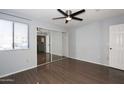 Bright bedroom with mirrored closet doors and wood-look flooring at 9450 N 95Th St # 118, Scottsdale, AZ 85258