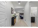 Bright and spacious entryway with tile flooring, offering views to the living room and kitchen at 23852 N 167Th Ln, Surprise, AZ 85387