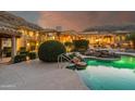 Stunning pool and patio area at sunset at 7801 N Sherri Ln, Paradise Valley, AZ 85253