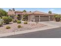 House exterior with two-car garage and desert landscaping at 3582 N 160Th Ave, Goodyear, AZ 85395