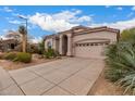 One-story home with arched entryway and desert landscaping at 3055 N Red Mtn # 77, Mesa, AZ 85207