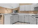 Clean and efficient kitchen with white cabinets and modern appliances at 1018 W Juniper Ave, Gilbert, AZ 85233