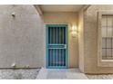 Private condo entrance with a security door at 14950 W Mountain View Blvd # 1105, Surprise, AZ 85374