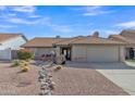 House exterior with desert landscaping and driveway at 6543 E Norwood St, Mesa, AZ 85215