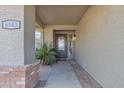 Front entry with a modern door and brick accents at 6543 E Norwood St, Mesa, AZ 85215