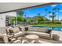 Covered patio with seating area, pool, and mountain views at 5800 N Monte Vista Dr, Paradise Valley, AZ 85253