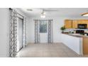 Dining area with tile floor, sliding glass door, and neutral decor at 23566 N High Dunes Dr, Florence, AZ 85132