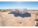 Aerial view of new construction home on desert lot at 15435 W Bajada Dr, Surprise, AZ 85387