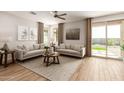 Spacious living room with large windows and sliding doors at 18252 W Cielo Grande Ave, Surprise, AZ 85387