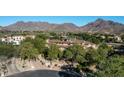 Aerial view of luxury home and mountain range at 19481 N 98Th Pl, Scottsdale, AZ 85255