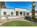 Stunning contemporary home with clean lines and a landscaped front yard at 5632 E Emile Zola Ave, Scottsdale, AZ 85254