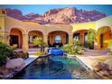 Luxury pool and spa with stunning mountain backdrop at 4836 E White Gates Dr, Phoenix, AZ 85018