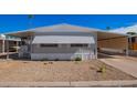 Front view of manufactured home with gravel yard at 2650 W Union Hills Dr # 258, Phoenix, AZ 85027