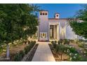 Landscaped pathway leading to the entrance with a fire feature at 7678 E Whisper Rock Trl, Scottsdale, AZ 85266