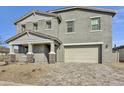 Two-story home with gray exterior and a two-car garage at 5616 W Paseo Way, Laveen, AZ 85339