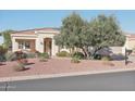 Single-story home with landscaped yard and desert landscaping at 13518 W Sola Dr, Sun City West, AZ 85375