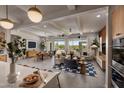 Open living room and kitchen with island and seating at 1427 E Cherrywood Pl, Chandler, AZ 85249