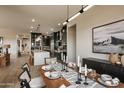 Open concept dining room with a wood table and contemporary decor at 1417 E Cherrywood Pl, Chandler, AZ 85249