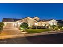 Beautiful home exterior at night with landscaping at 2086 E Mead Dr, Gilbert, AZ 85298