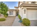 Front yard with walkway leading to the entrance and garage at 218 E Sunburst Ln, Tempe, AZ 85284