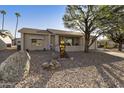 House with a rock front yard and mature trees at 739 S 80Th St, Mesa, AZ 85208