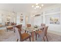 Spacious dining area with glass table and seating for four at 15625 W Heritage Dr, Sun City West, AZ 85375