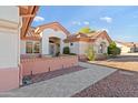 Front entrance to a house with a walkway leading to the front door at 15625 W Heritage Dr, Sun City West, AZ 85375