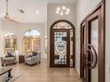 Bright entryway with hardwood floors, stylish door, and comfortable seating at 1618 E Briarwood Ter, Phoenix, AZ 85048