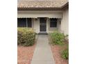 Front entry with security door and walkway at 20407 N 107Th Dr, Sun City, AZ 85373
