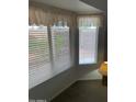 Bedroom with window blinds and carpet at 20407 N 107Th Dr, Sun City, AZ 85373