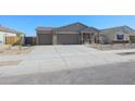 Two-car garage and front yard with desert landscaping at 3431 S 177Th Ave, Goodyear, AZ 85338