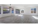 Spacious dining area with gray tile floors and sliding glass doors at 1207 N Velero St, Chandler, AZ 85225