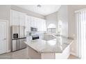Modern kitchen featuring white cabinets, granite countertops, and stainless steel appliances at 8753 E Greenview Dr, Gold Canyon, AZ 85118