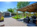 Relaxing backyard oasis with covered patio and lush lawn at 1921 E Brill St, Phoenix, AZ 85006