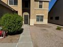 Two-story house with a walkway leading to the front door, landscaping, and a gravel driveway at 2474 E Westchester Dr, Chandler, AZ 85249