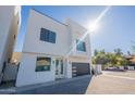 Modern two-story home with sleek design and dark garage door at 2130 E Turney Ave # 4, Phoenix, AZ 85016